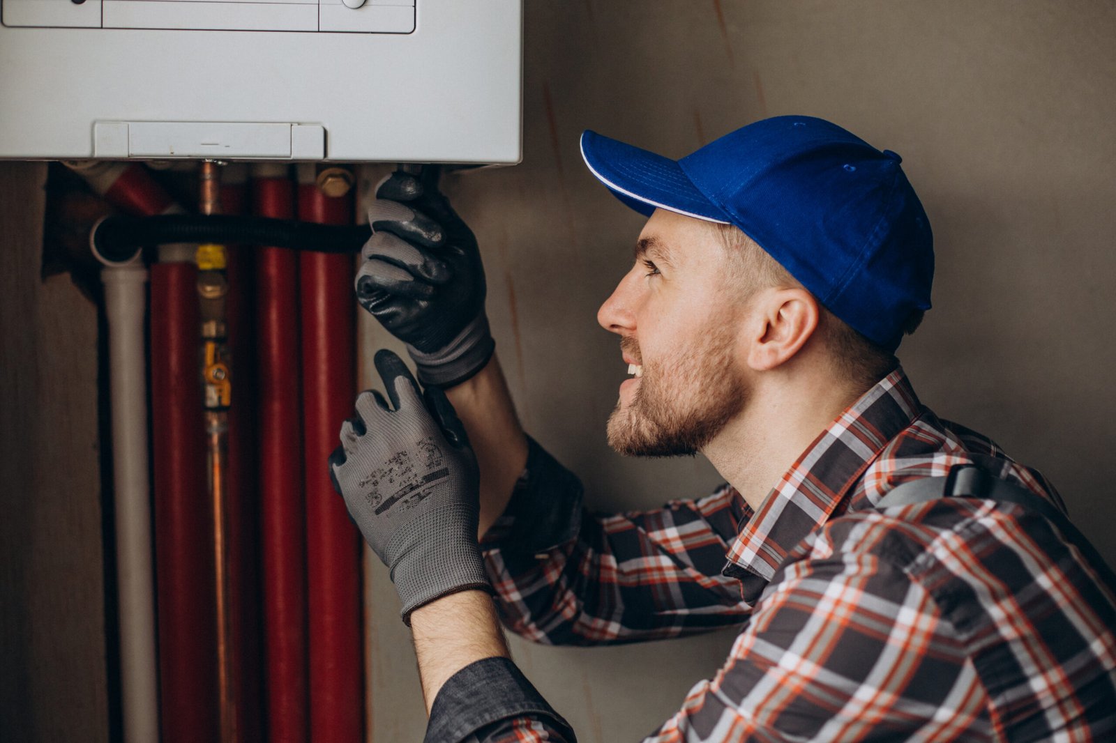 HVAC technician repairing a residential gas furnace