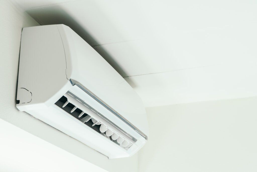 Mini split system pipes hidden inside drywall during home installation process