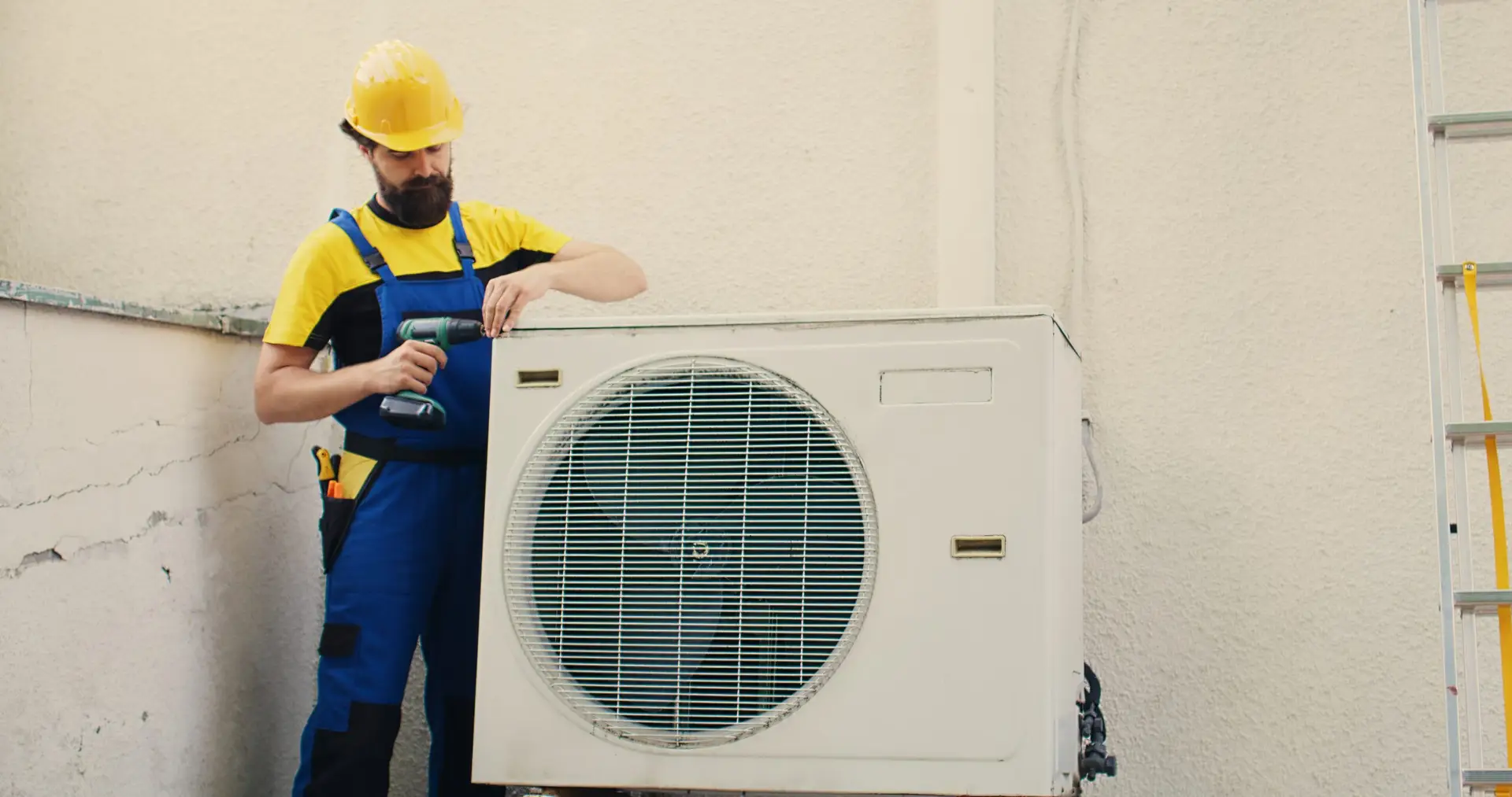 Technician installing ductless mini split air conditioning system in Dallas Texas home
