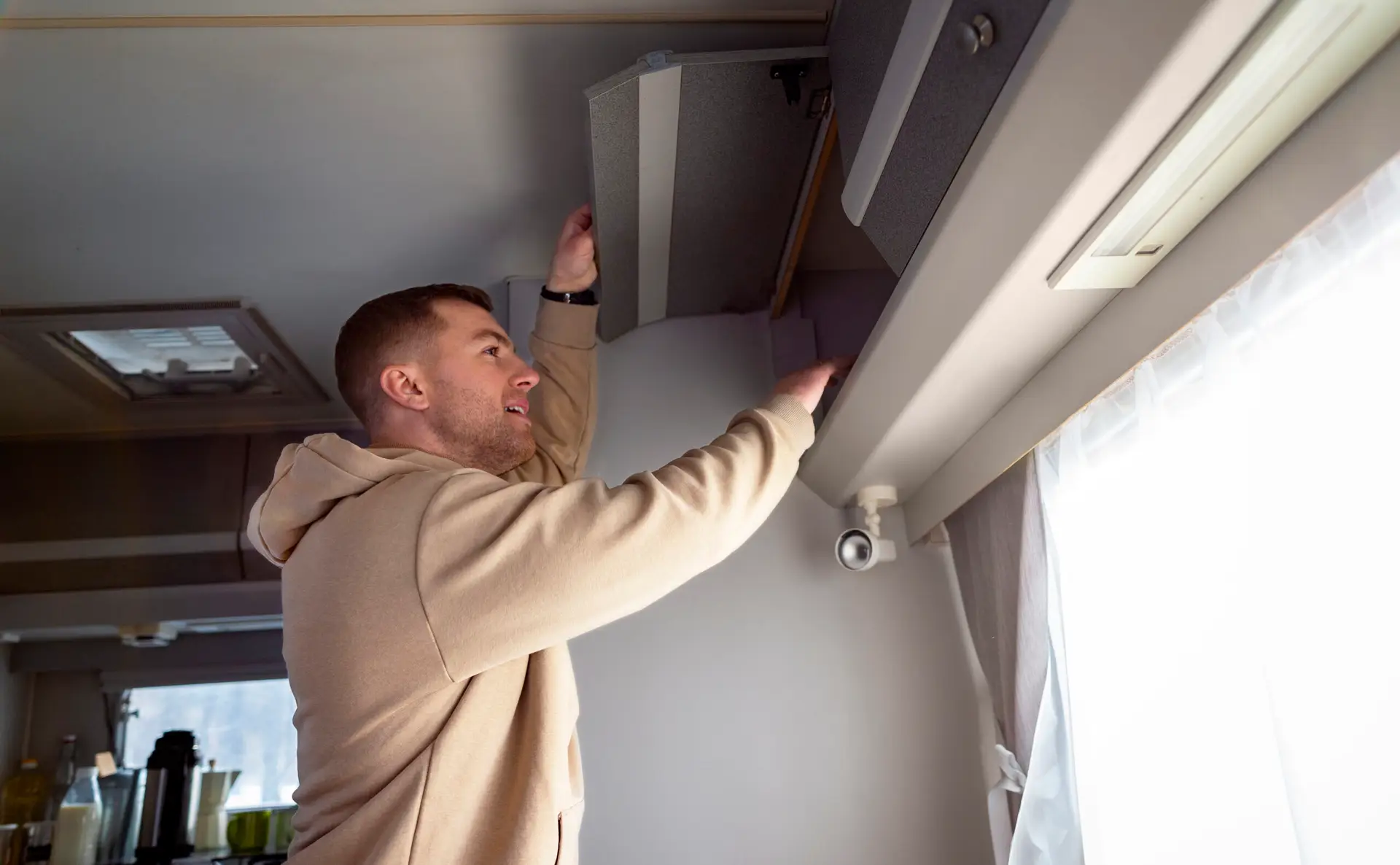 Technician servicing mini split AC unit for maintenance and repair
