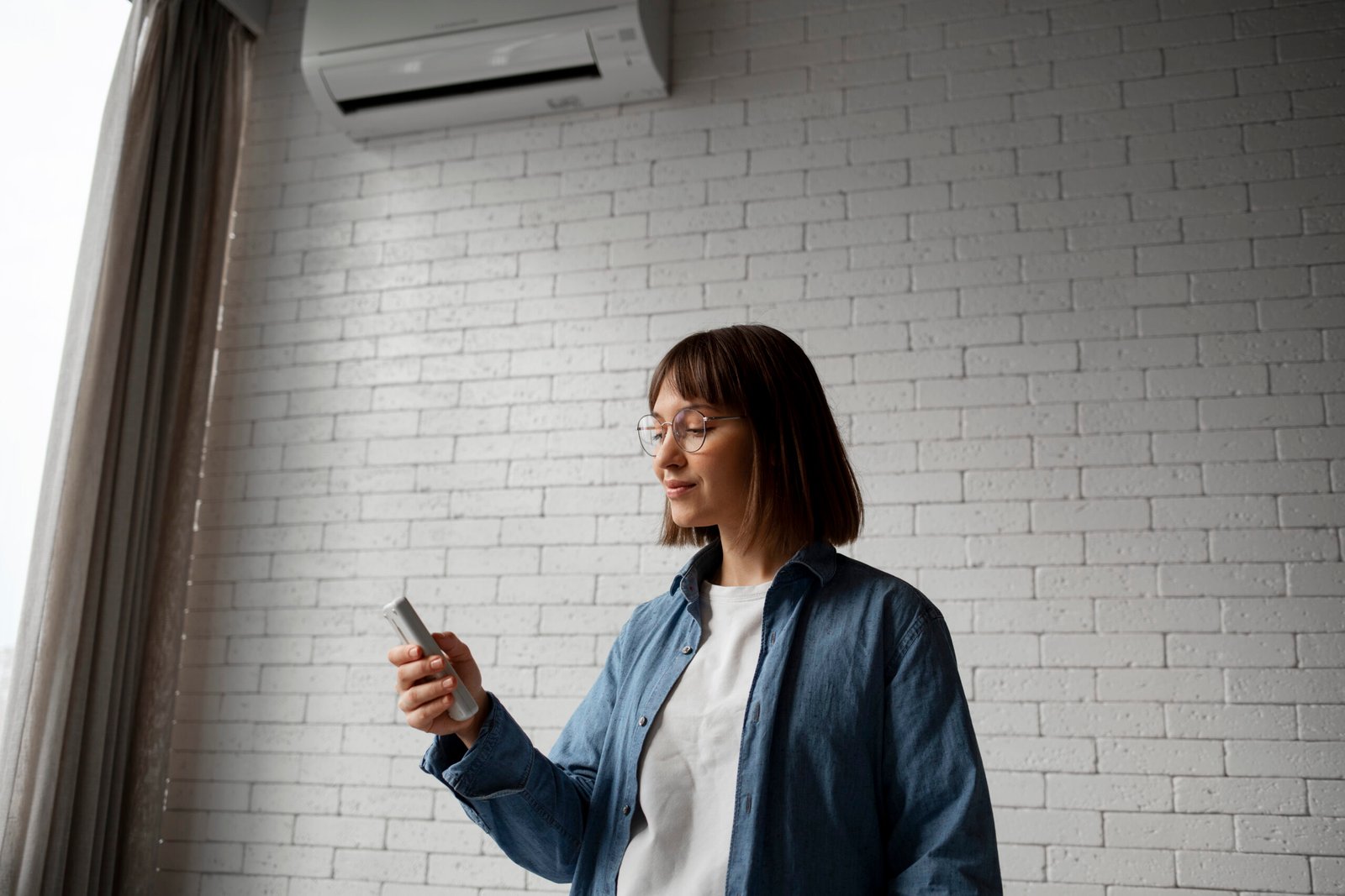 Woman using smartphone in modern room